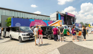 Festival attendees and campervans at VW Bus Fest 2023
